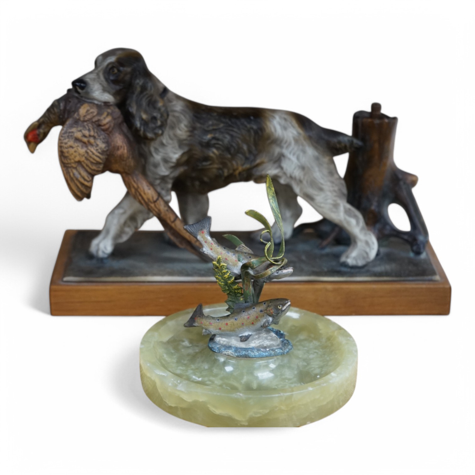 A cold painted bronze and onyx ‘rainbow trout’ ashtray and a painted spelter ‘hunting dog’ table lighter, 27cm. Condition - fair to good